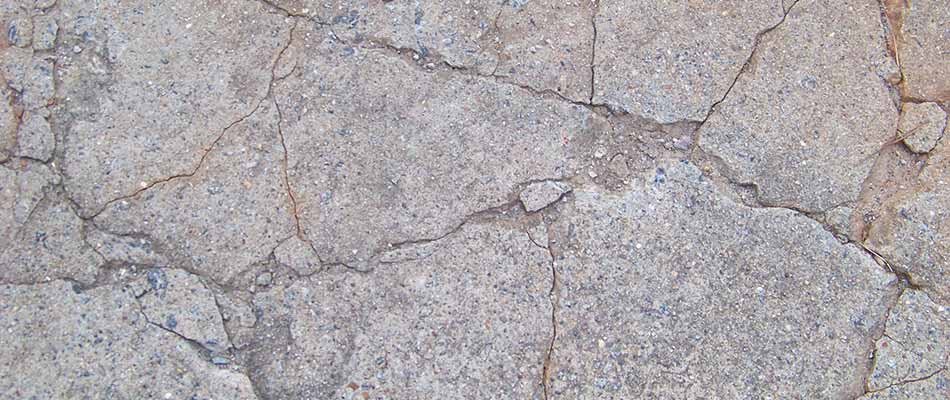 Deep cracks in a home driveway in Lebanon, TN.