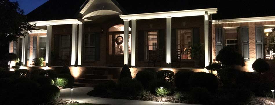 home with outdoor lighting