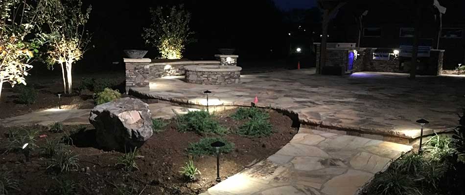 Outdoor lighting at this Lebanon property highlights the features of the property and provides security.