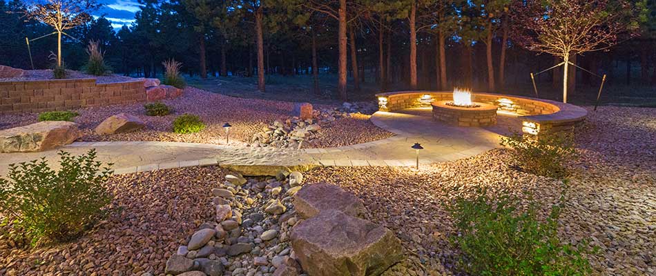 Outdoor living area with walkways, a fire pit, and outdoor lighting in Green Hill, TN